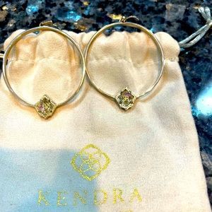 Kendra Scott silver earrings.
